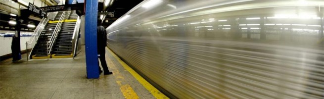 A speeding train in the NYC subway.