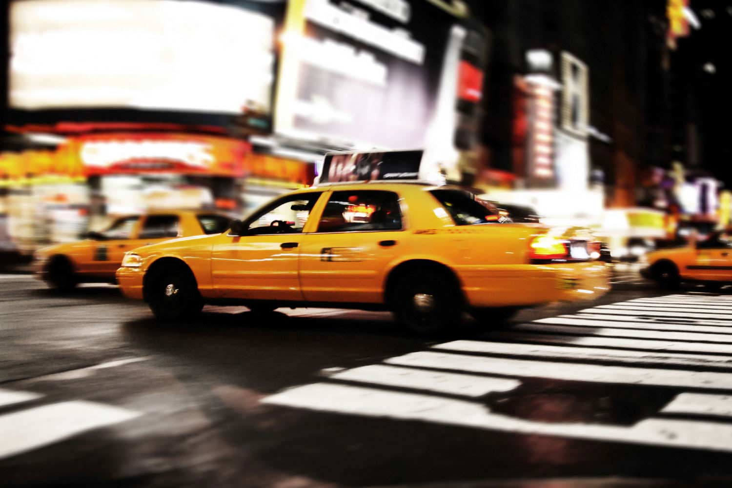Yellow cap driving by at night